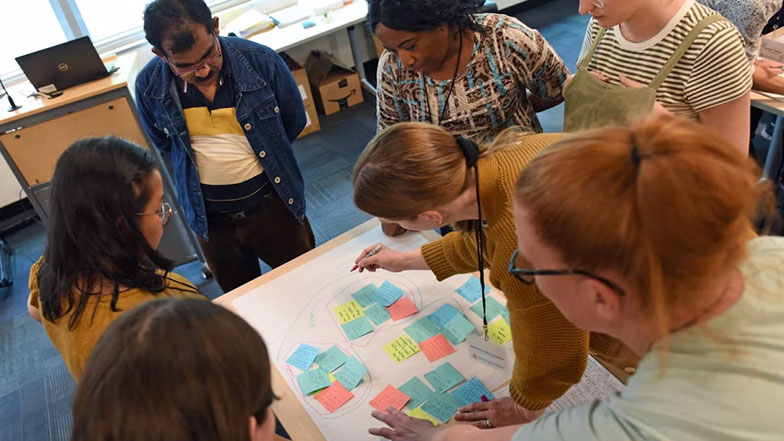 educators brainstorming with students at OpenCitizen event.