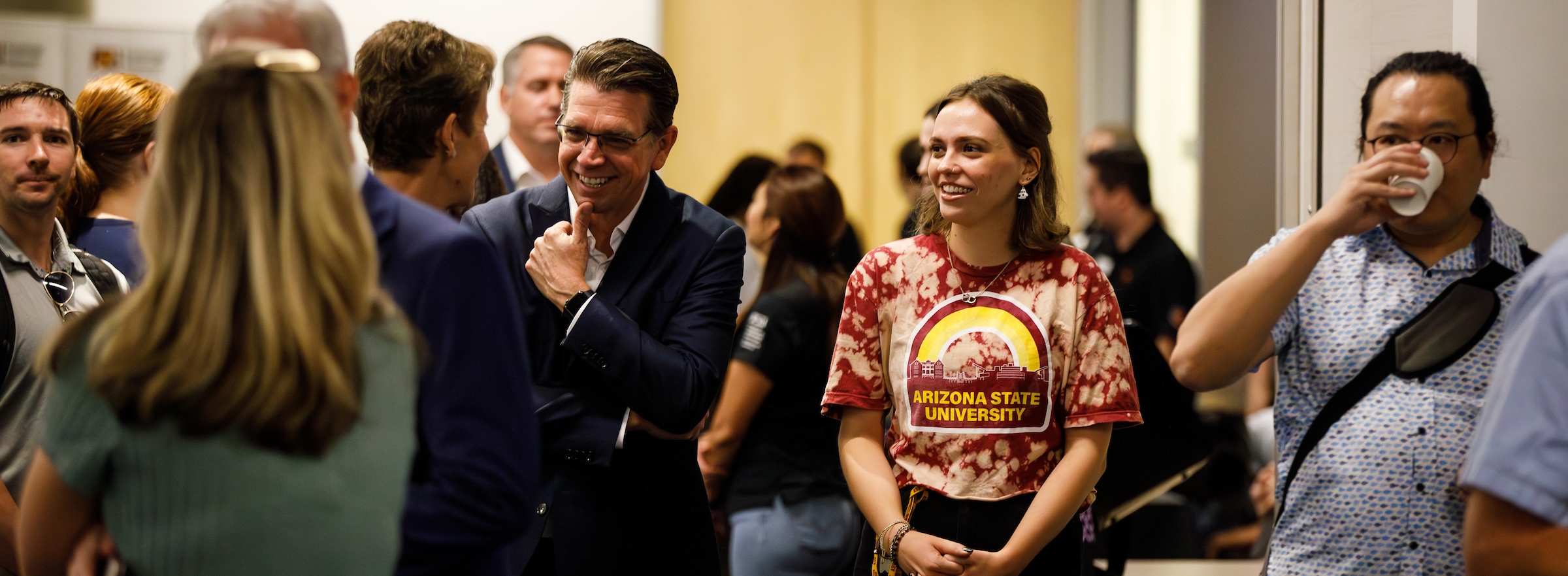 A variety of people gather and converse at an ASU event